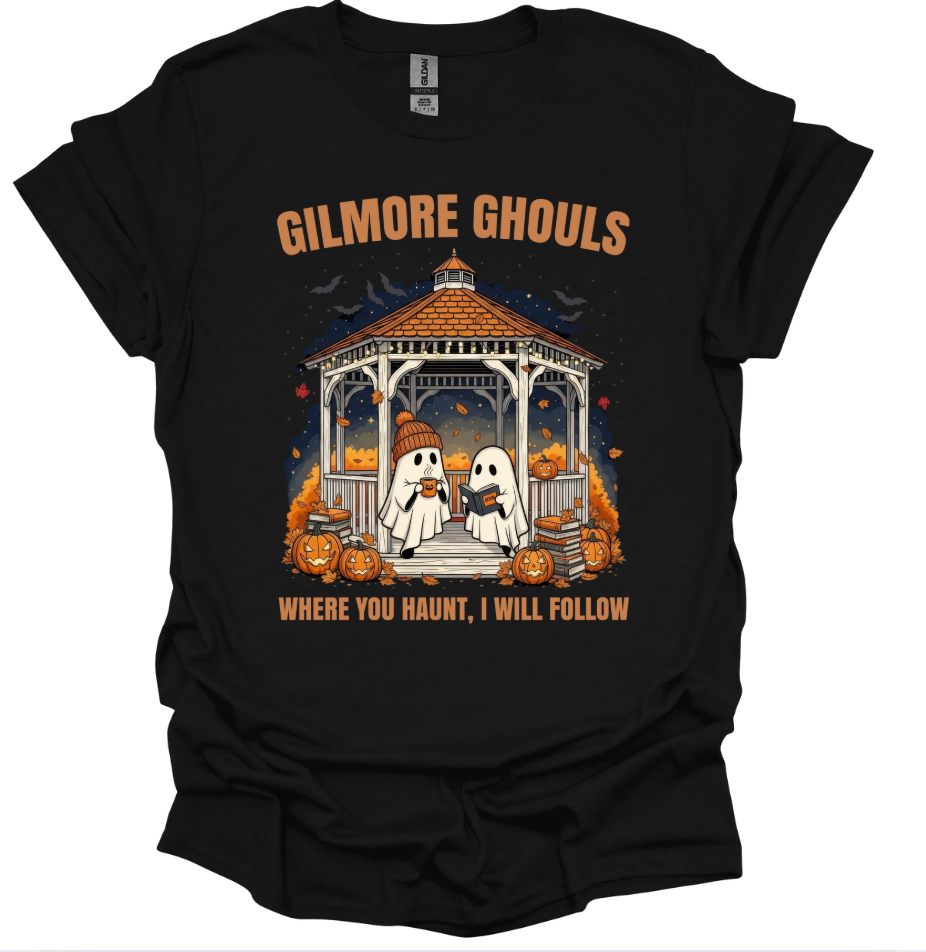 Black t-shirt with Halloween-themed design featuring ghosts and pumpkins, text 'Gilmore Ghouls' and 'Where you haunt, I will follow'.